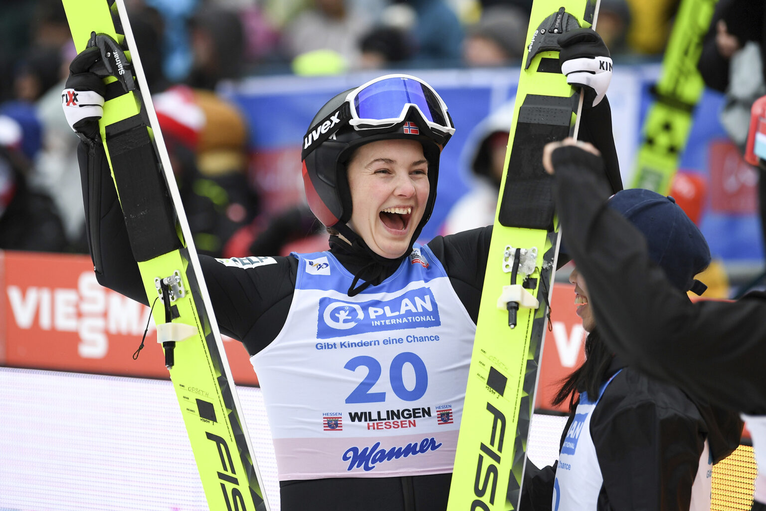 Winner Silje Opseth from Norway celebrates after her second jump in the women's large hill competition at the Ski Jumping World Cup in Willingen, Germany, Sunday, Feb. 4, 2024. (Swen Pfoertner/dpa via AP)